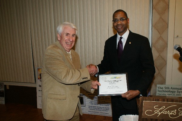 Arnie Lanckton (l), chapter symposia chairman, receives the 2012 Professional of the Year Award from Rick Lockridge, chapter president, at the Mohawk Valley Executive Engineering Council's 63rd Annual Engineers Banquet in April.